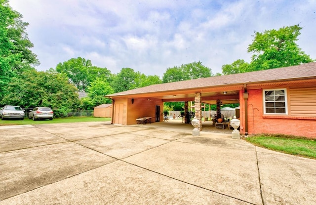 exterior space with a carport