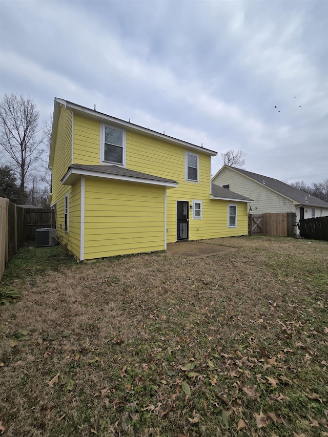 back of house featuring central AC unit