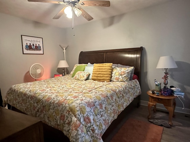 bedroom featuring dark hardwood / wood-style floors and ceiling fan