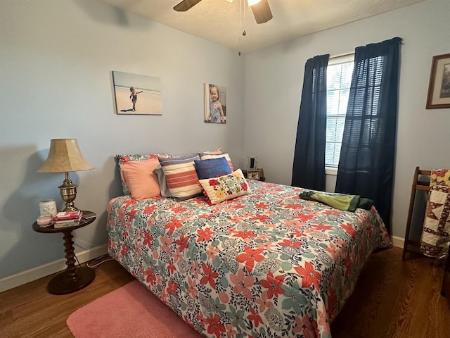 bedroom featuring dark hardwood / wood-style floors and ceiling fan