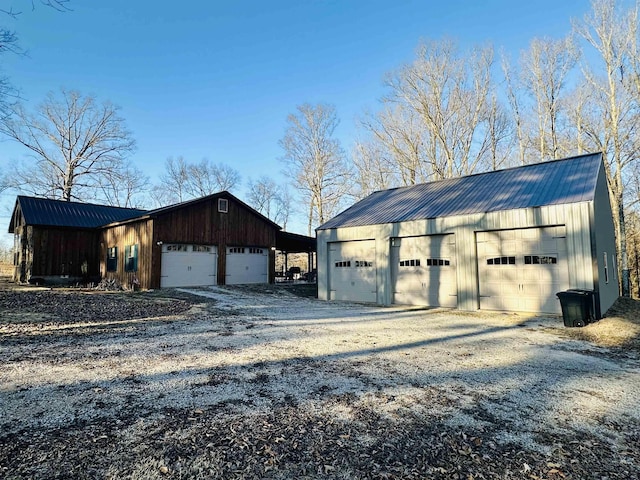 exterior space with a garage and an outdoor structure