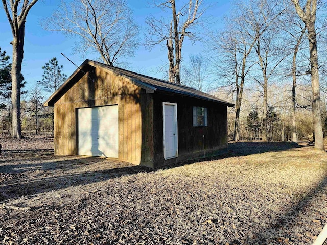 view of outbuilding with a garage