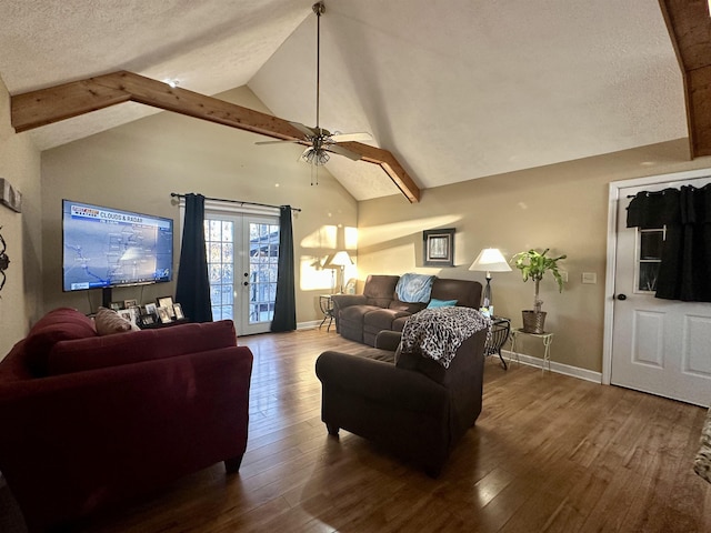 living room featuring ceiling fan, lofted ceiling with beams, hardwood / wood-style floors, and a textured ceiling