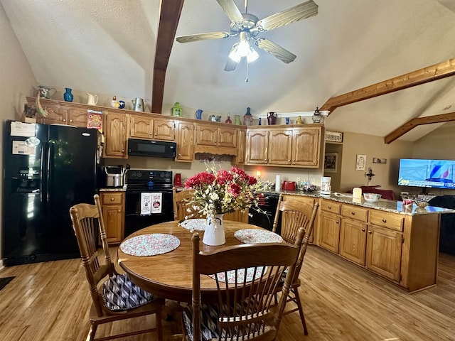 dining room with ceiling fan, light hardwood / wood-style flooring, and vaulted ceiling with beams