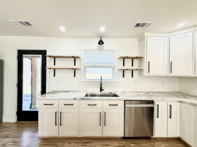 kitchen with white cabinetry, dishwasher, wood-type flooring, sink, and light stone counters