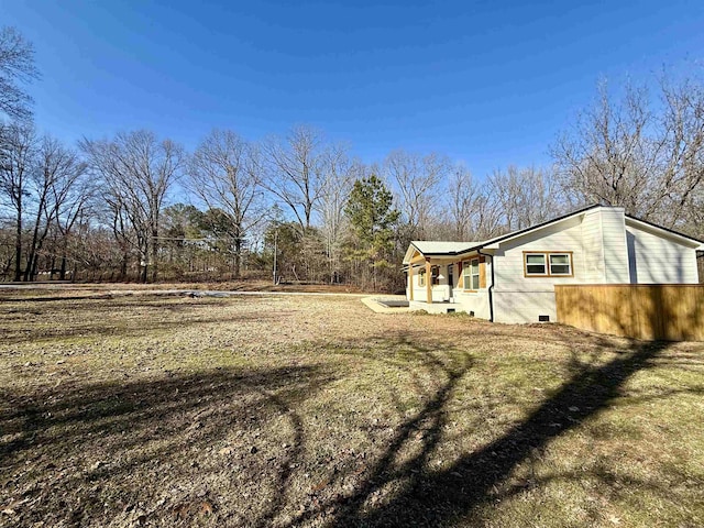 view of yard with covered porch