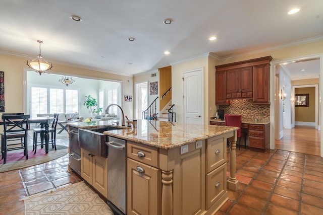 kitchen with tasteful backsplash, stainless steel dishwasher, crown molding, and a kitchen island with sink