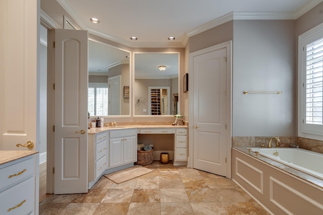 bathroom featuring vanity, a bathing tub, and ornamental molding