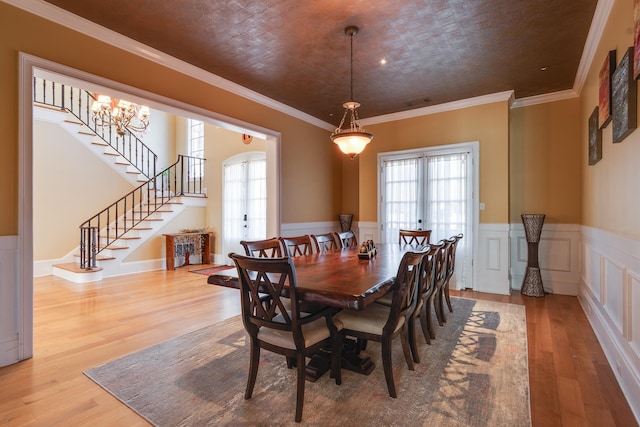 dining room featuring crown molding and wood-type flooring