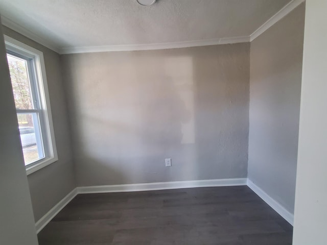 spare room featuring ornamental molding, dark hardwood / wood-style flooring, and a textured ceiling