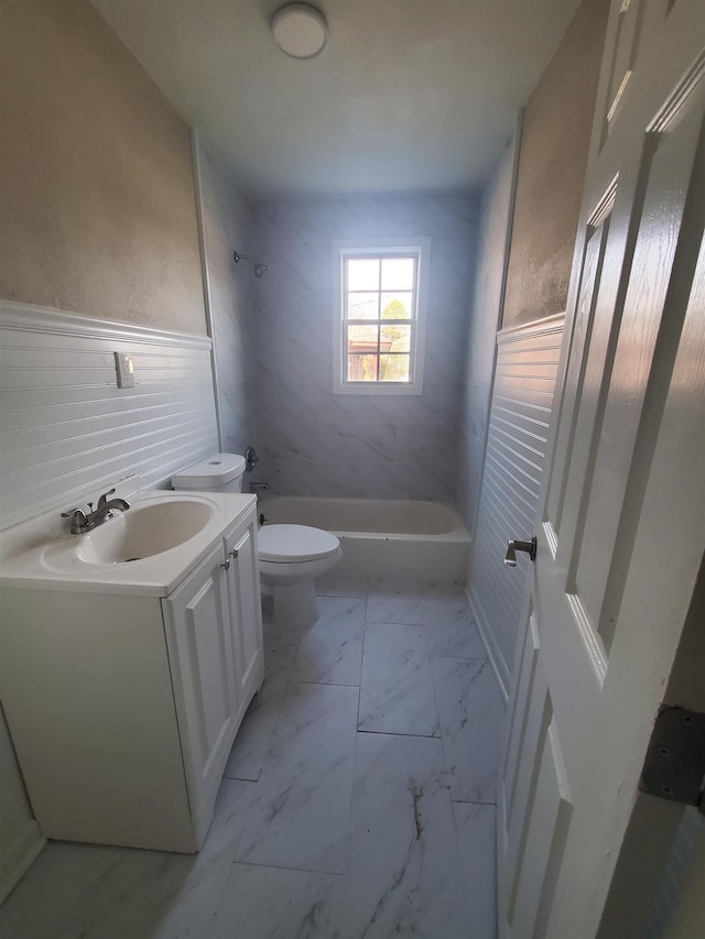 full bathroom featuring shower / bath combination, vanity, and toilet