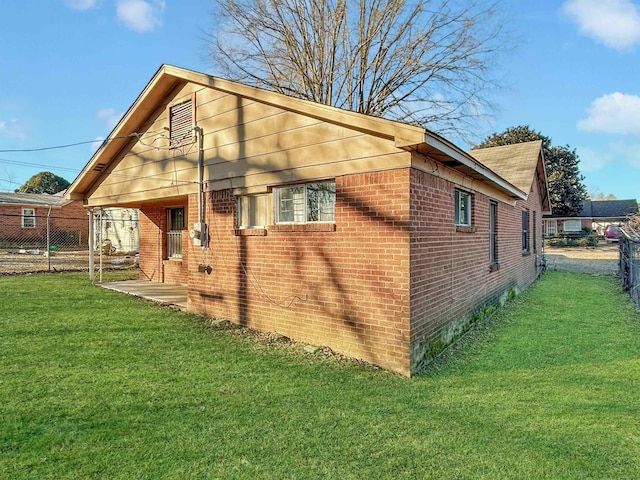 view of property exterior with a yard