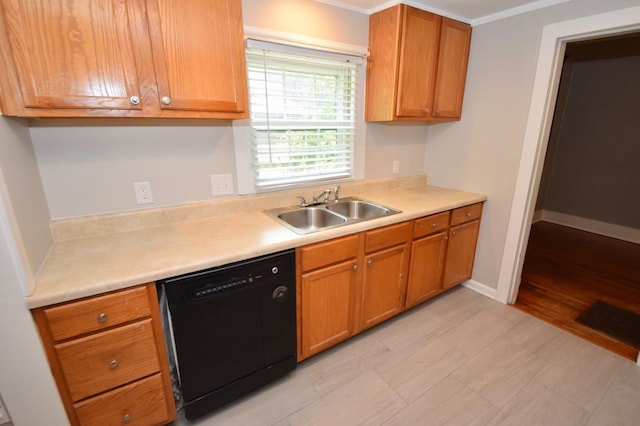 kitchen featuring ornamental molding, black dishwasher, and sink