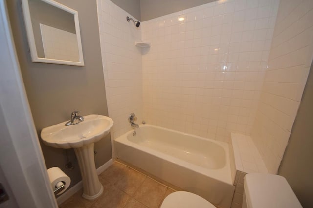 bathroom featuring tile patterned flooring,  shower combination, and toilet