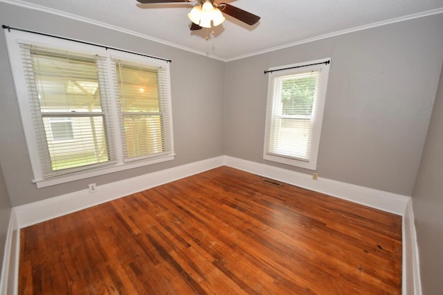 unfurnished room with hardwood / wood-style flooring, ornamental molding, and ceiling fan