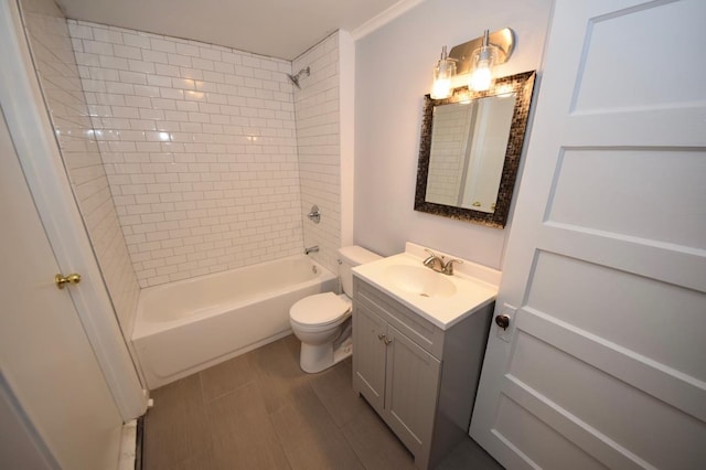 full bathroom with vanity, tiled shower / bath combo, and toilet