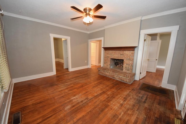 unfurnished living room featuring a brick fireplace, crown molding, hardwood / wood-style floors, and ceiling fan