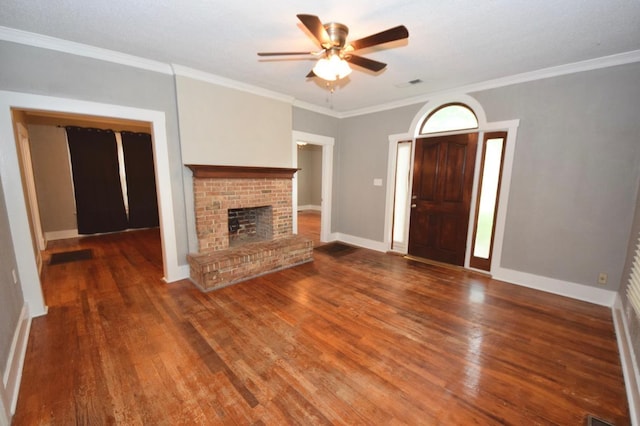 unfurnished living room featuring hardwood / wood-style floors and ornamental molding