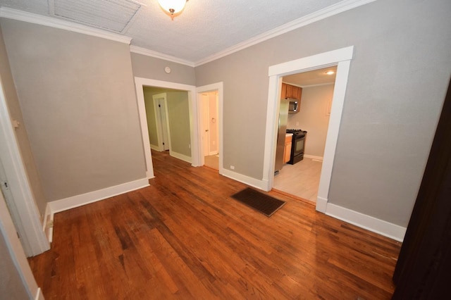 interior space with hardwood / wood-style flooring and crown molding