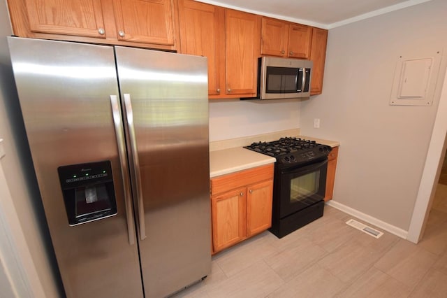 kitchen featuring crown molding and appliances with stainless steel finishes