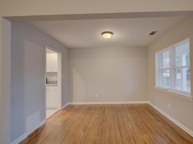 empty room featuring hardwood / wood-style flooring