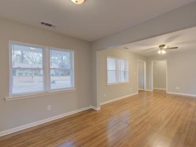 empty room featuring ceiling fan and light hardwood / wood-style flooring