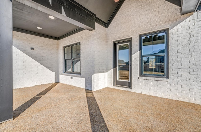 property entrance with a patio area