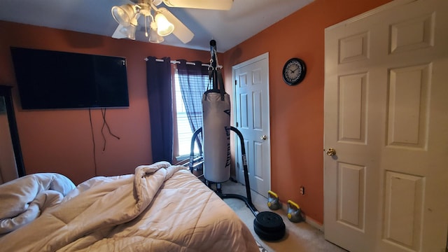 bedroom with ceiling fan and carpet floors