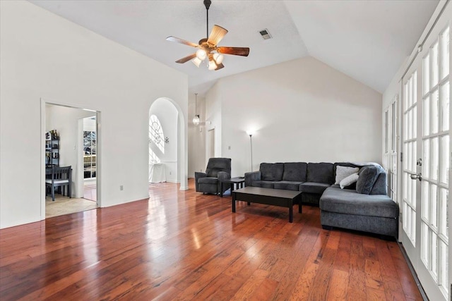 living room featuring lofted ceiling, hardwood / wood-style floors, and ceiling fan