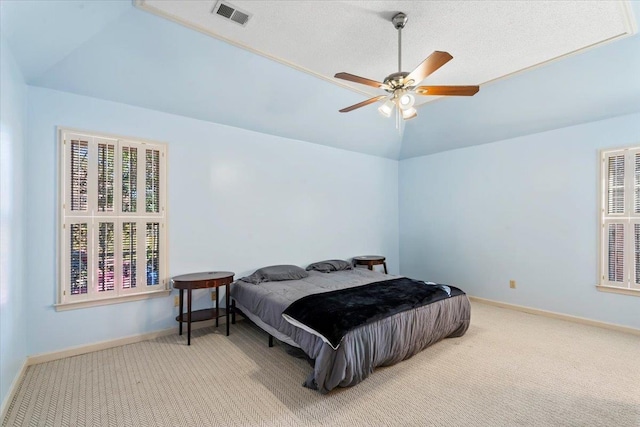 carpeted bedroom with lofted ceiling and ceiling fan