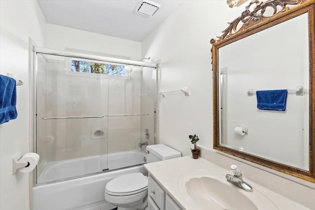 full bathroom featuring enclosed tub / shower combo, vanity, and toilet