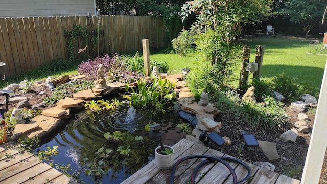 view of yard with a garden pond