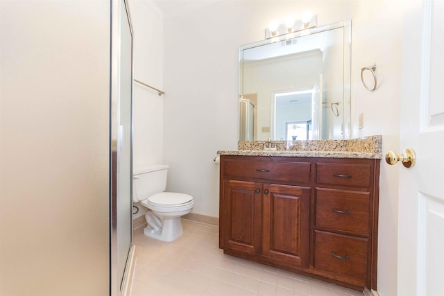 bathroom featuring a shower with door, vanity, tile patterned floors, and toilet