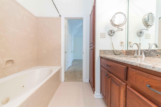 bathroom featuring vanity and a washtub