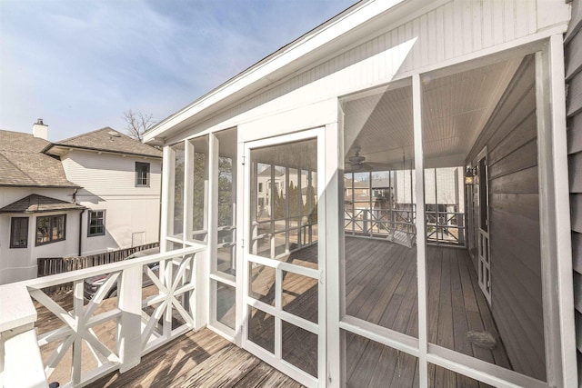 wooden deck featuring a sunroom