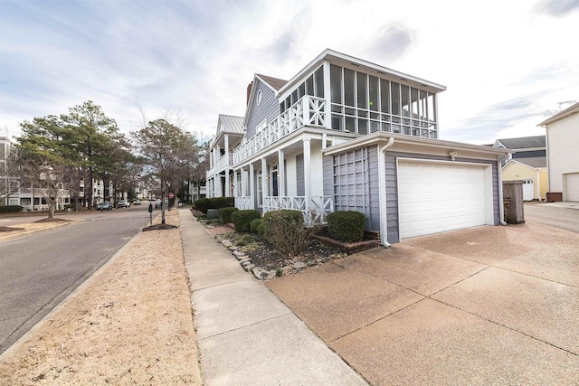 view of property exterior featuring a sunroom