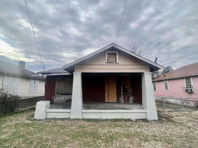 back of house with a yard