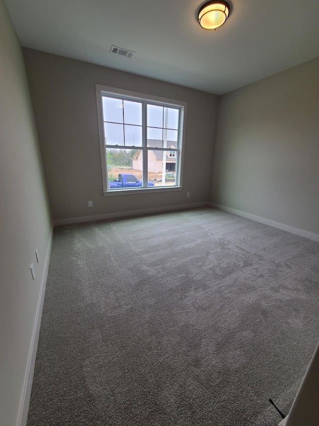 unfurnished room featuring carpet flooring