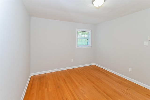 spare room featuring hardwood / wood-style floors