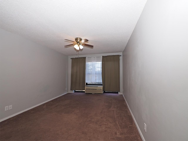 carpeted empty room with ceiling fan and a textured ceiling