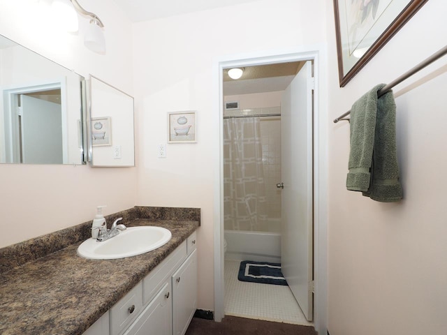 bathroom with vanity, tile patterned flooring, and shower / bath combination