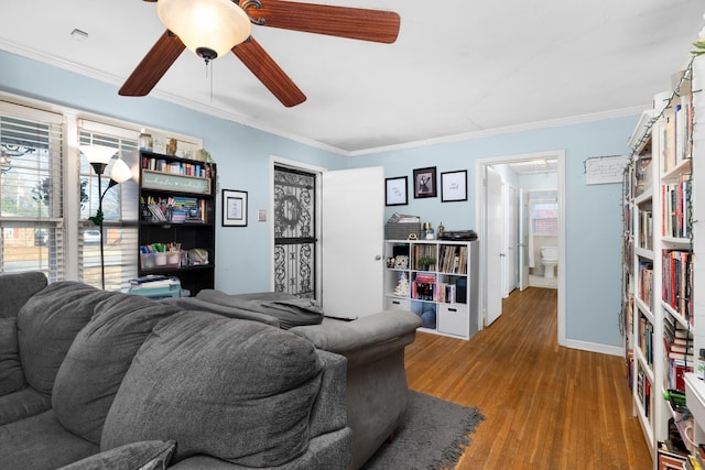 living room with ceiling fan, ornamental molding, and hardwood / wood-style floors