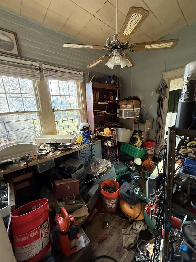 miscellaneous room featuring ceiling fan, hardwood / wood-style floors, and a workshop area