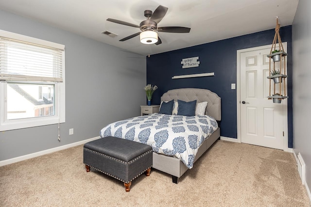 carpeted bedroom featuring ceiling fan