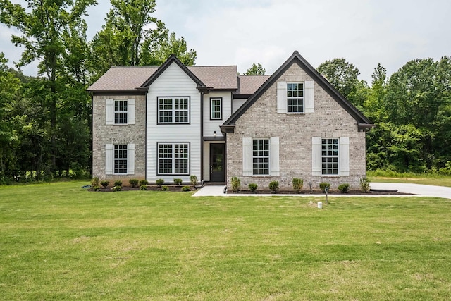 view of front of home with a front yard