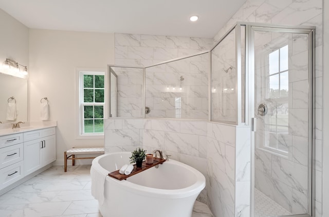 bathroom with vanity and plus walk in shower