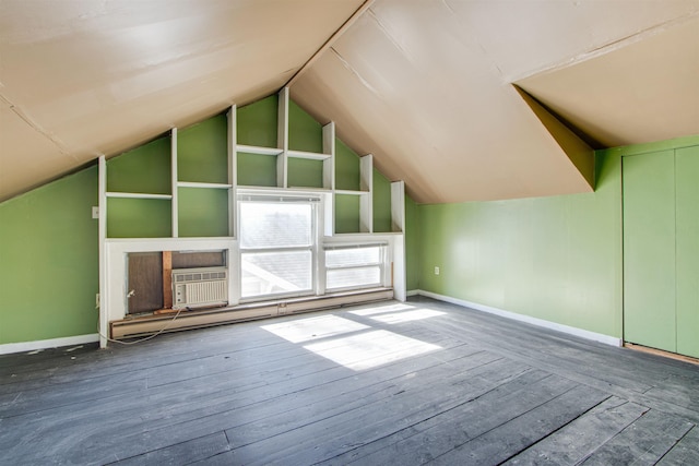 bonus room featuring cooling unit, lofted ceiling, wood-type flooring, and a baseboard heating unit