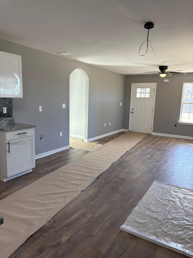 entrance foyer with ceiling fan and dark hardwood / wood-style flooring