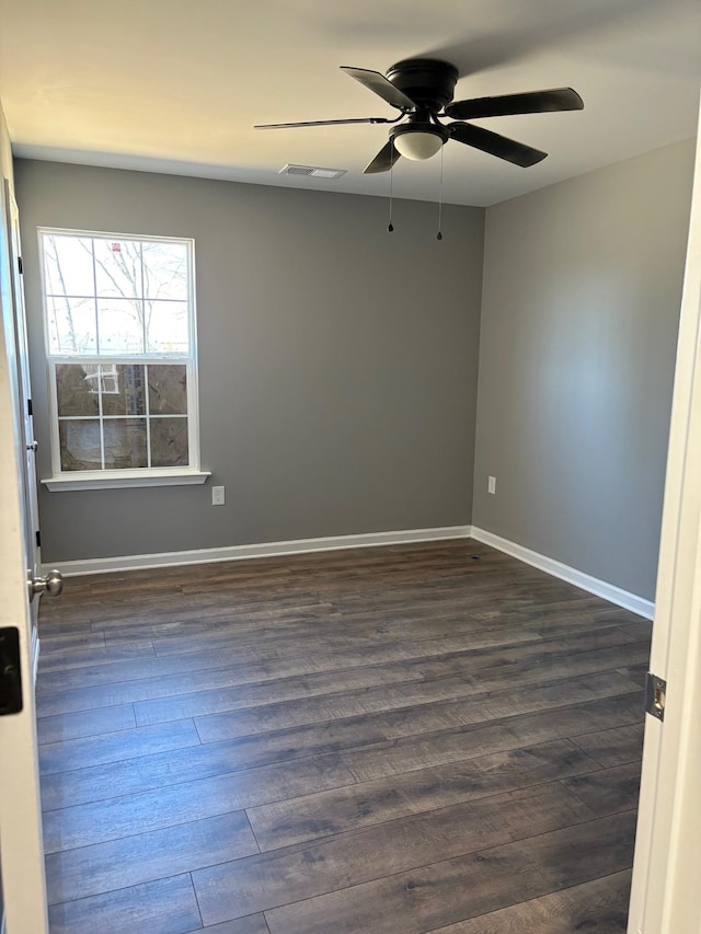 unfurnished room featuring ceiling fan and dark hardwood / wood-style flooring