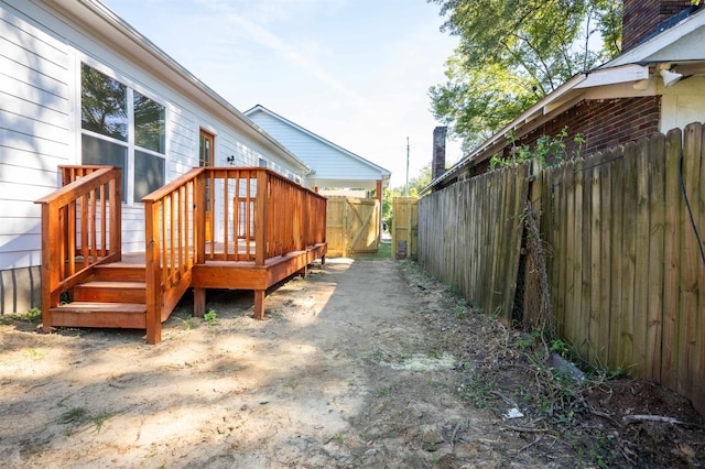 view of side of property with a wooden deck